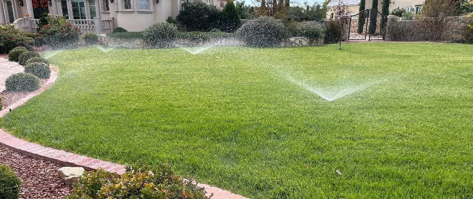 Running sprinklers on a lawn in East El Paso, TX.